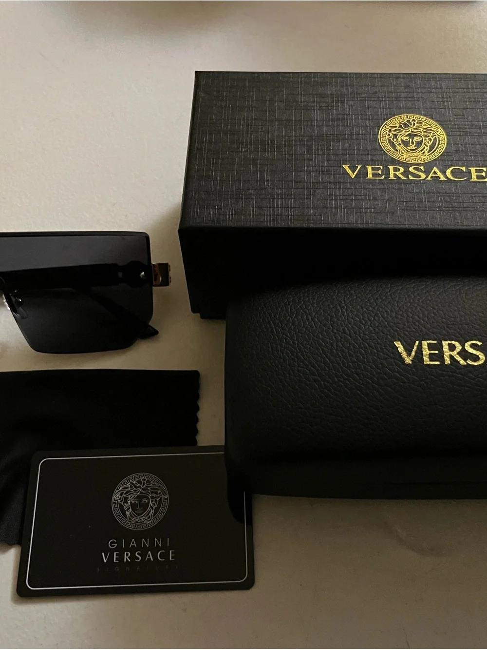 Versace Black Sunglasses with Gold Accents and Case